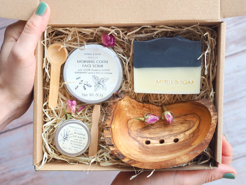 Gift set with face scrub, lip balm, natural soap and wooden soap dish.