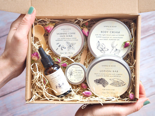 Luxury skincare set with lotion bar, body cream, face scrub, facial oil and whipped lip balm.